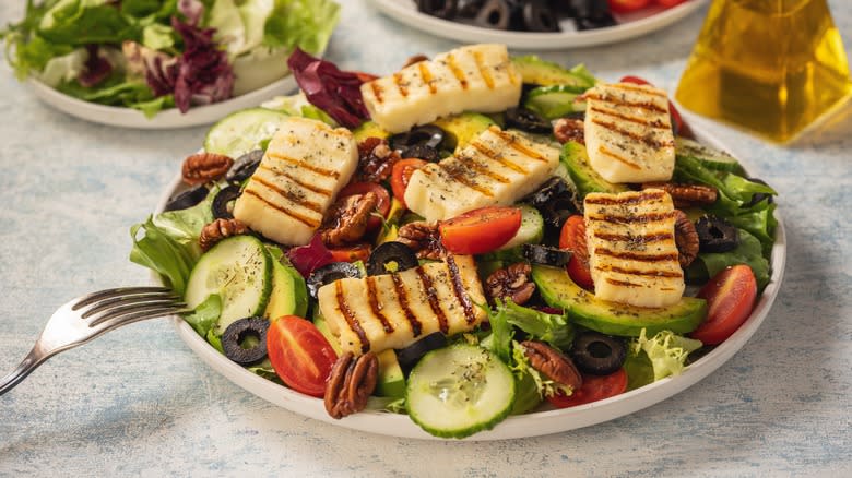 Salad topped with halloumi cheese