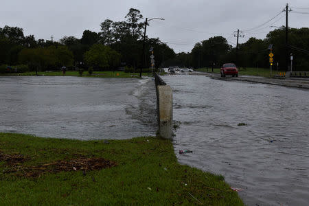 Brays Bayou flows over a bridge after Hurricane Harvey inundated the Texas Gulf coast with rain causing widespread flooding, in Houston, Texas, U.S. August 27, 2017. REUTERS/Nick Oxford