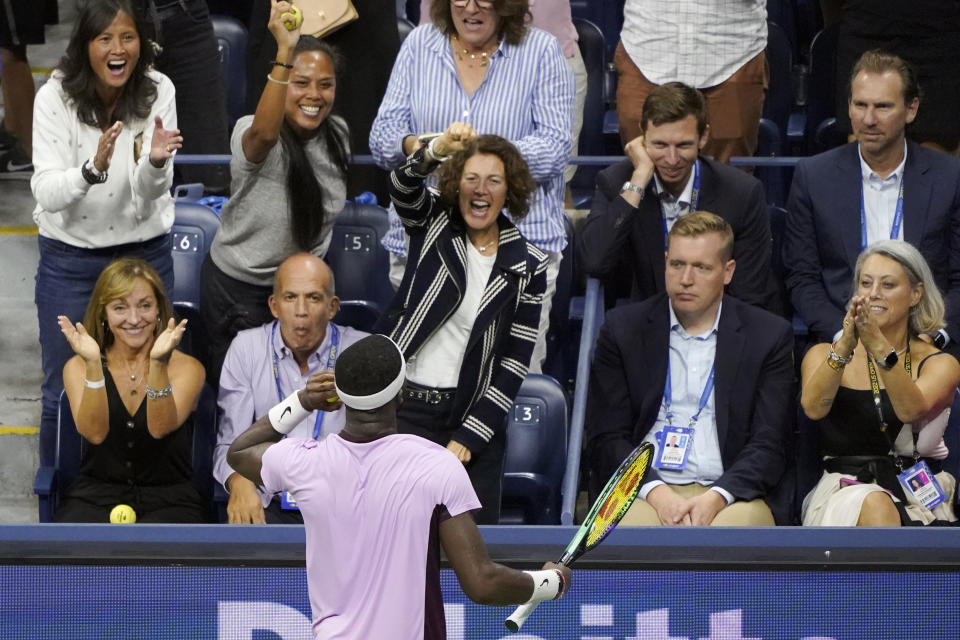 Frances Tiafoe, of the United States, gestures to the crowd after scoring a point against Carlos Alcaraz, of Spain, during the semifinals of the U.S. Open tennis championships, Friday, Sept. 9, 2022, in New York. (AP Photo/Mary Altaffer)
