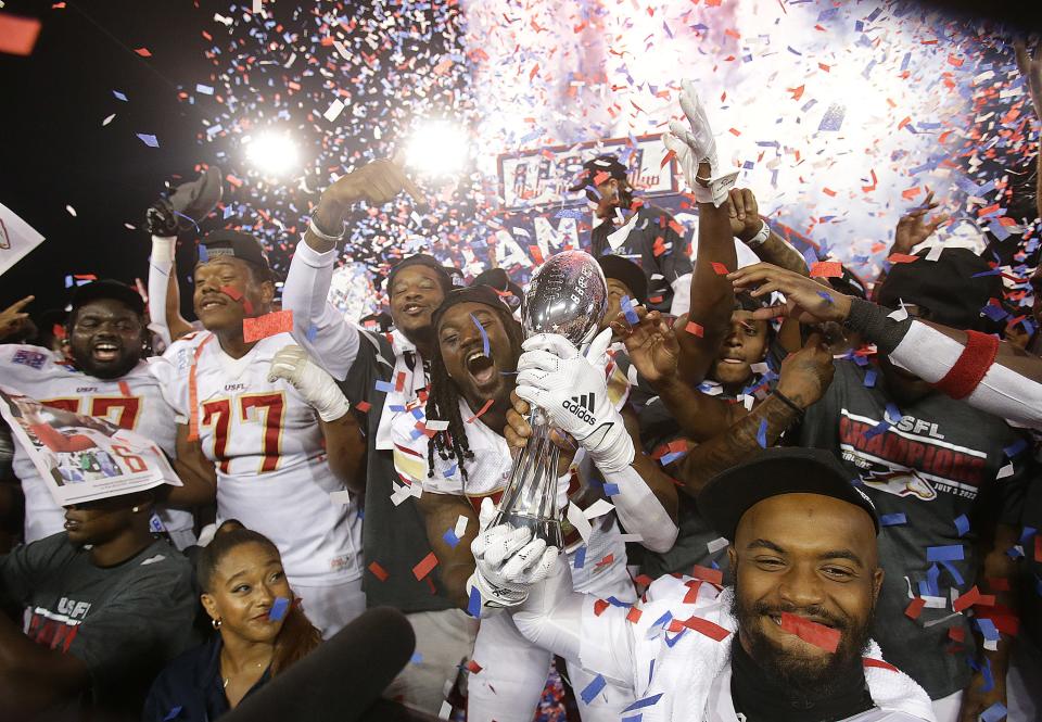 The Birmingham Stallions celebrate with the USFL championship trophy after beating the Philadelphia Stars for the championship at Tom Benson Hall of Fame Stadium in Canton, Sunday, July 3, 2022.