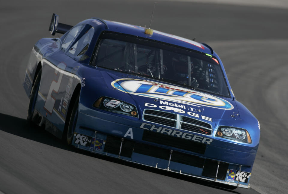 FILE -NASCAR driver Kurt Busch drives his car through turn three during NASCAR Car of Tomorrow testing at Pocono Raceway in Long Pond, Pa., Wednesday, May 28, 2008. NASCAR’s next 75 years almost certainly will include at least a partially electric vehicle turning laps at Daytona International Speedway. It’s unfathomable to some, unconscionable to others. (AP Photo/Carolyn Kaster, File)