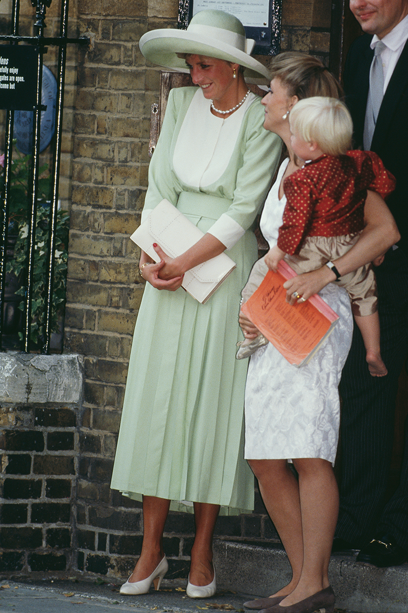 <p>Princess Diana famously nailed the wedding guest fashion brief, and this mint green and cream look (complete with the matching hat) is a case in point.</p>