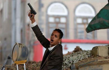 A Houthi militant reacts as he sits on a tank after the death of Yemen's former president Ali Abdullah Saleh in Sanaa, Yemen December 4, 2017. REUTERS/Khaled Abdullah