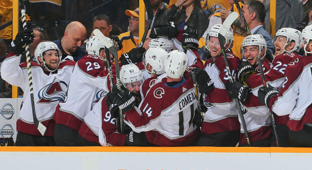 The Avalanche celebrate after scoring the go-ahead goal late in the third period. (Photo by Frederick Breedon/Getty Images)