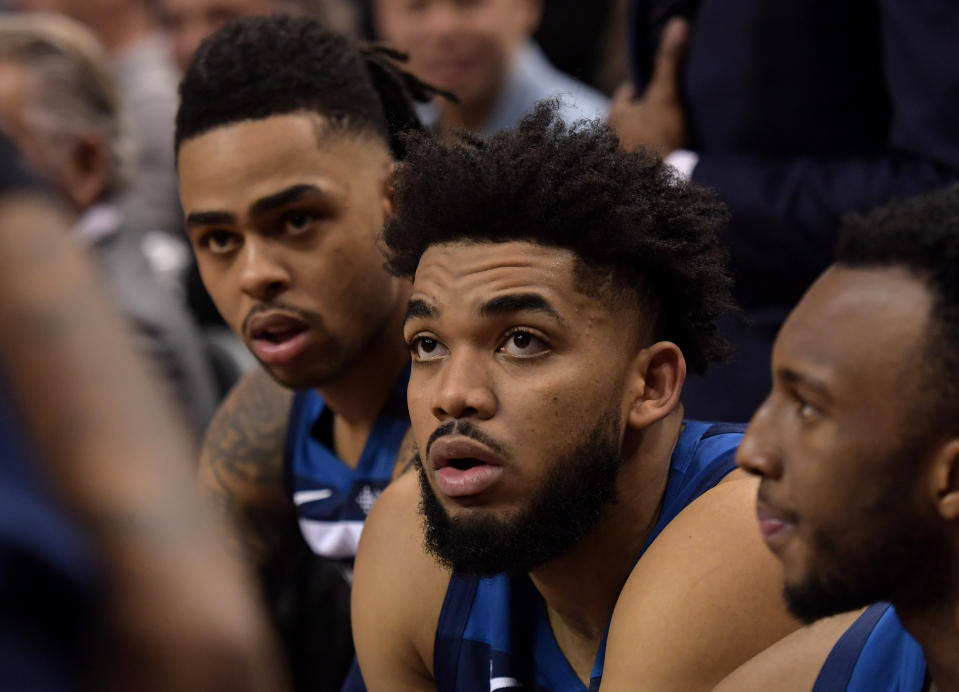 Feb 10, 2020; Toronto, Ontario, CAN; Minnesota Timberwolves center Karl-Anthony Towns (32, center) and guard D'Angelo Russell (0, left) listen to coaching instruction during a time out against Toronto Raptors in the first half at Scotiabank Arena.