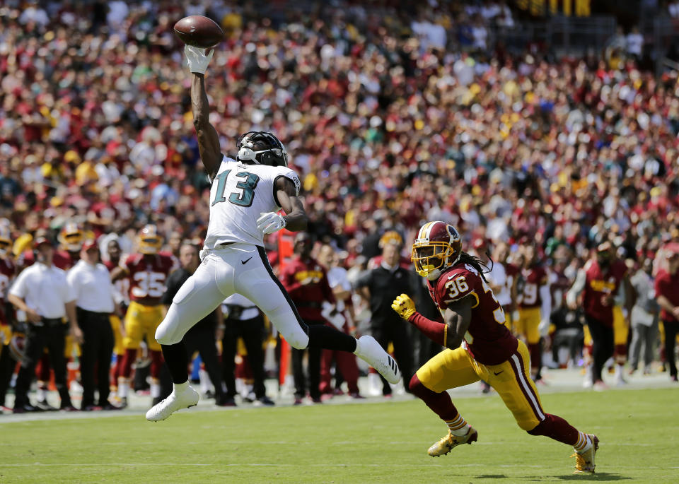 <p>Philadelphia Eagles wide receiver Nelson Agholor, left, makes a catch in front of Washington Redskins free safety D.J. Swearinger in the first half of an NFL football game, Sunday, Sept. 10, 2017, in Landover, Md. (AP Photo/Mark Tenally) </p>