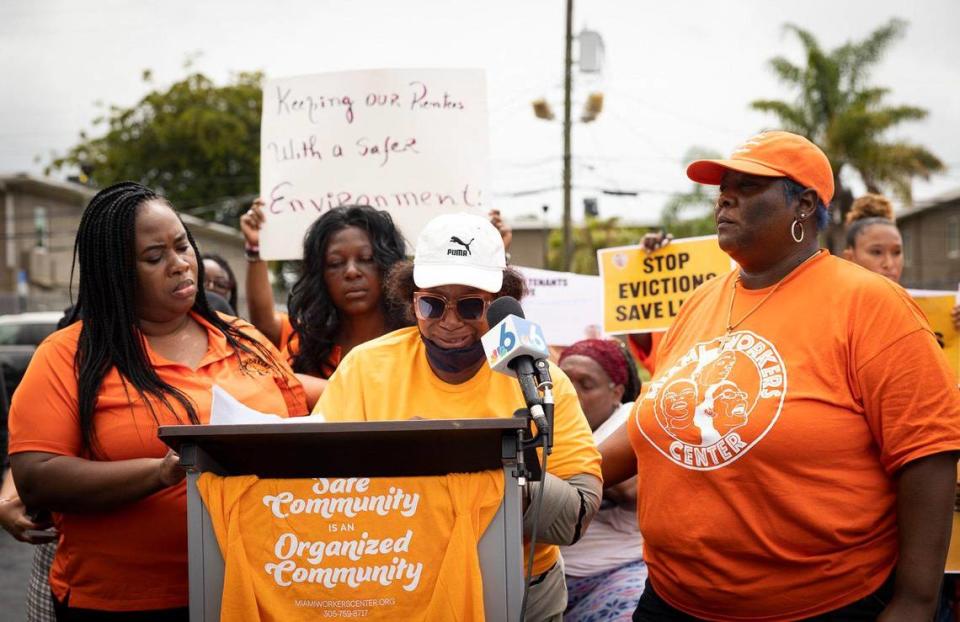 Jahniee, tenant at Lincoln Fields Apartments, cries while telling her story with the support of Santra Denis, left, and Devetroia Stratford, from the Miami Workers Center, during a press conference outside of the income-based housing Lincoln Fields Apartments on Tuesday, May 23, 2023, down the street from Liberty Square in Miami. “Please help with the vilence again us, please help my children, please help us with the mold, please,” said Jahniee.