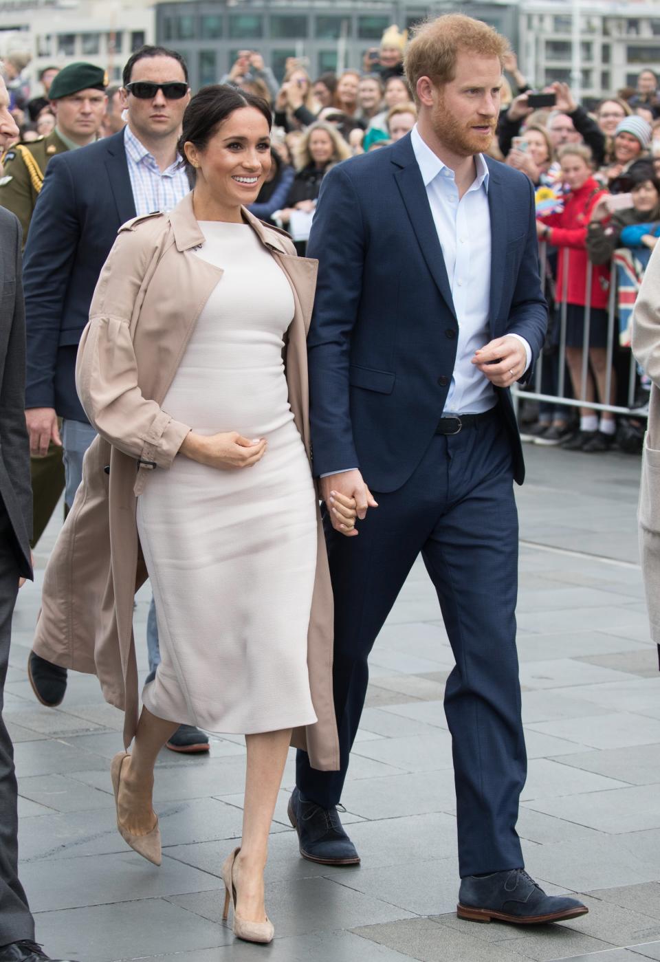 With the end of her royal tour in sight, Markle returned to classic silhouettes: the sheath dress (by Brandon Maxwell) and the trench coat (by Burberry).