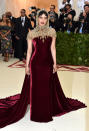 <p>Chopra paired a strapless Ralph Lauren dress with a jeweled hood. (Photo: Getty Images) </p>