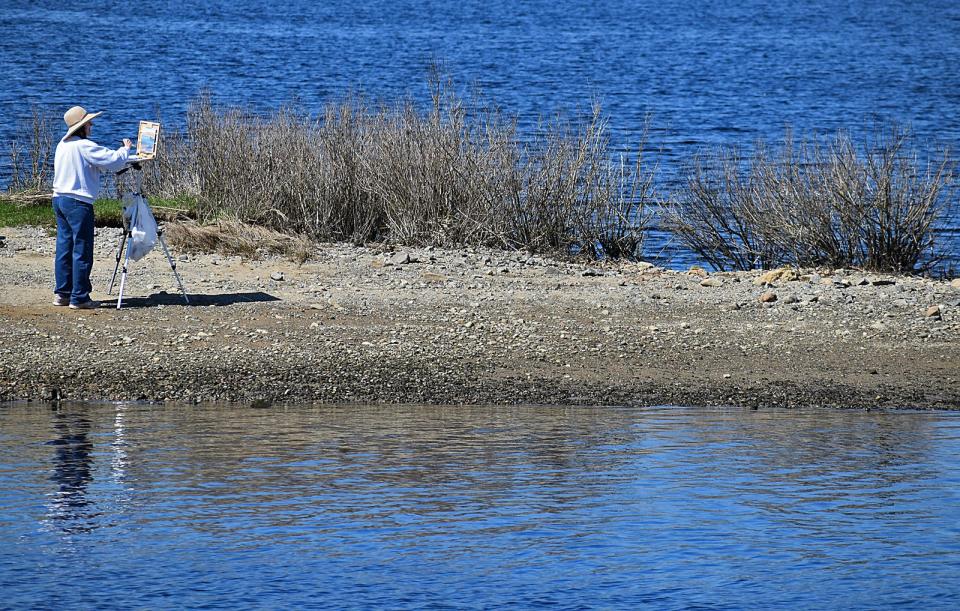 A woman paints at Broad Cove in Somerset Tuesday, April 23, 2024.