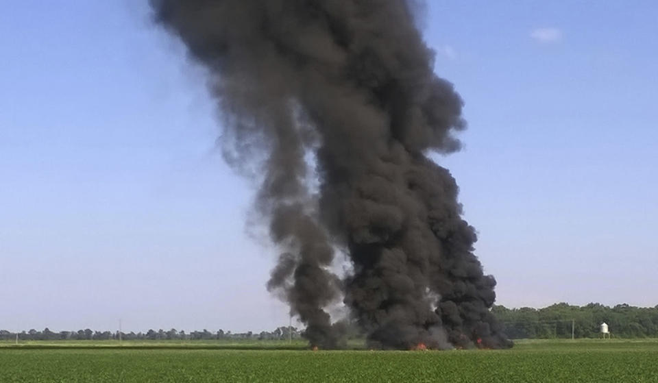 <p> In this photo provided by Jimmy Taylor, smoke and flames rise into the air after a military transport airplane crashed in a field near Itta Bena, Miss., on the western edge of Leflore County, Monday, July 10, 2017, killing several. (Jimmy Taylor via AP) </p>