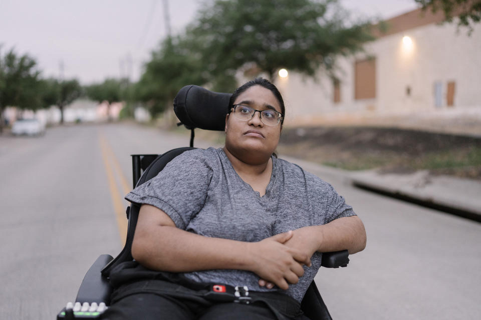 Joy Moonan next to her apartment building in Dallas on July 20, 2022. Moonan, an attorney and disability-rights advocate, uses a wheelchair due to her cerebral palsy.<span class="copyright">Morgan Lieberman</span>