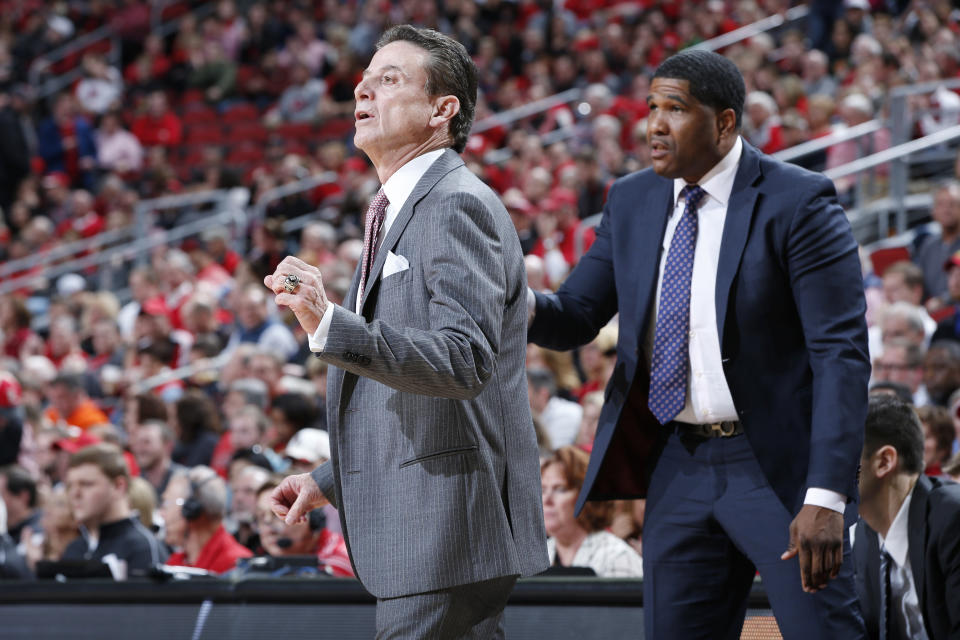 Former Louisville head coach Rick Pitino, left, and former assistant Kenny Johnson during the game against Clemson on January 19, 2017 in Louisville, Kentucky.