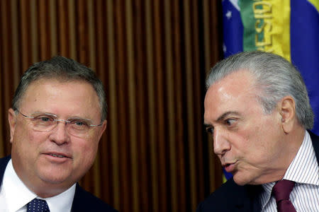 Brazil's Agriculture Minister Blairo Maggi speaks with Brazil's President Michel Temer during a meeting with ambassadors of meat importing countries of Brazil at the Planalto Palace in Brasilia, Brazil March 19, 2017. REUTERS/Ueslei Marcelino