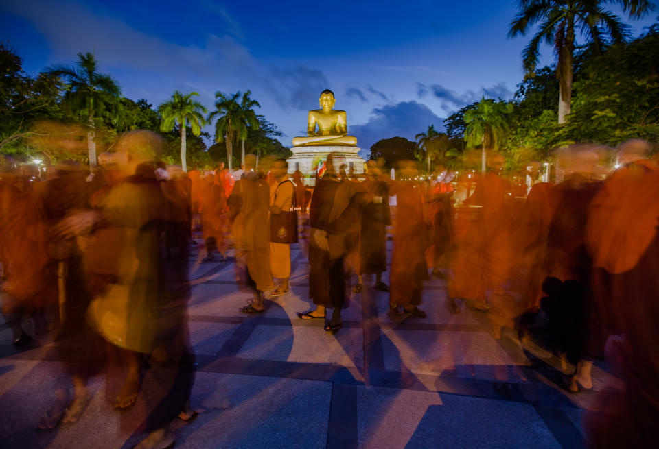 <p>In this long exposure photograph, Monks from Myanmar residing in Sri Lanka engage in a peaceful demonstration to show solidarity with Buddhist community in Myanmar at Colombo, Sri Lanka, Sept. 19, 2017. (Photo: Tharaka Basnayaka/NurPhoto via Getty Images) </p>