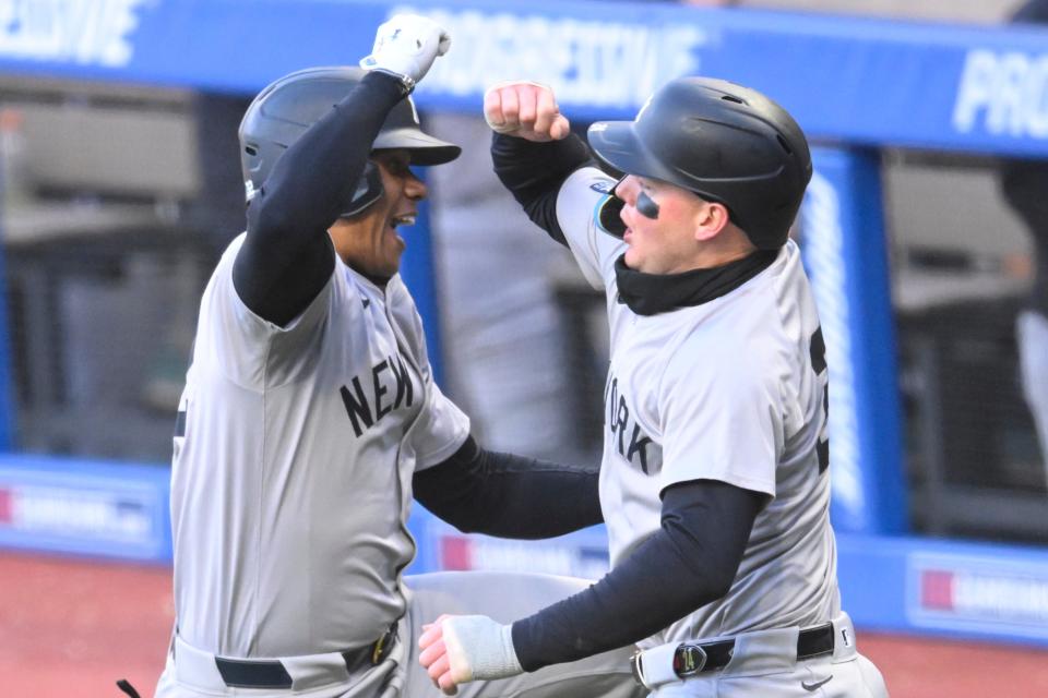 New York Yankees right fielder Juan Soto (22) celebrate his three-run home run with left fielder Alex Verdugo (24) in the fourth inning against the Cleveland Guardians on Saturday in Cleveland.