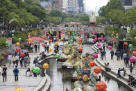 People walk at the Cheonggye Stream during launch time in Seoul, South Korea, on May 22, 2020. People are increasingly dining out and enjoying nighttime strolls in public parks. As South Korea significantly relaxes its rigid social distancing rules as a result of waning coronavirus cases, the world is paying close attention to whether it can return to something that resembles normal or face a virus resurgence. (AP Photo/Ahn Young-joon)