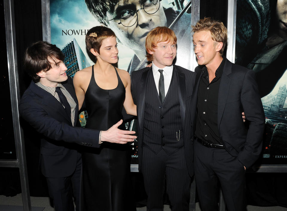 Daniel Radcliffe, Emma, Rupert Grint, and Tom at a movie premiere