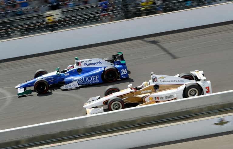 Takuma Sato of Japan, driver of the Andretti Autosport Honda, races ahead of Helio Castroneves of Brazil on May 28, 2017