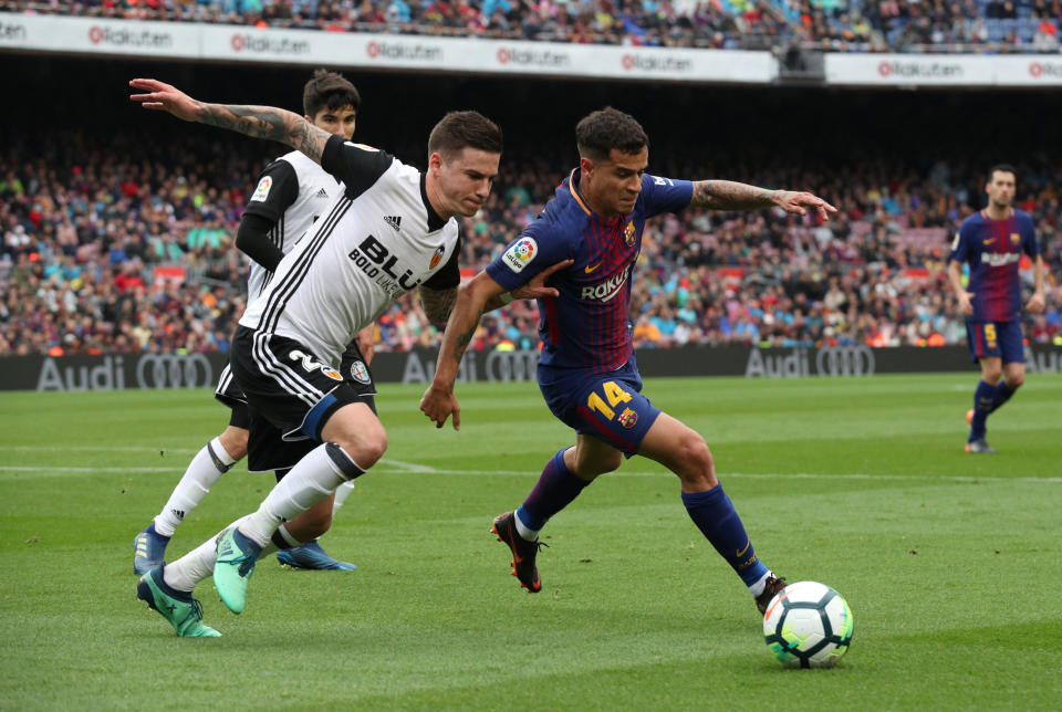 Barcelona’s Philippe Coutinho set up Luis Suarez for a pretty goal against Valencia on Saturday. (Reuters)