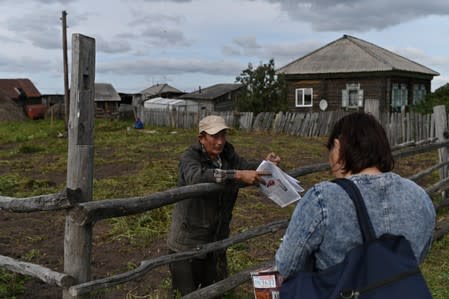 The Wider Image: Russian village's last teacher stays on for her one remaining pupil