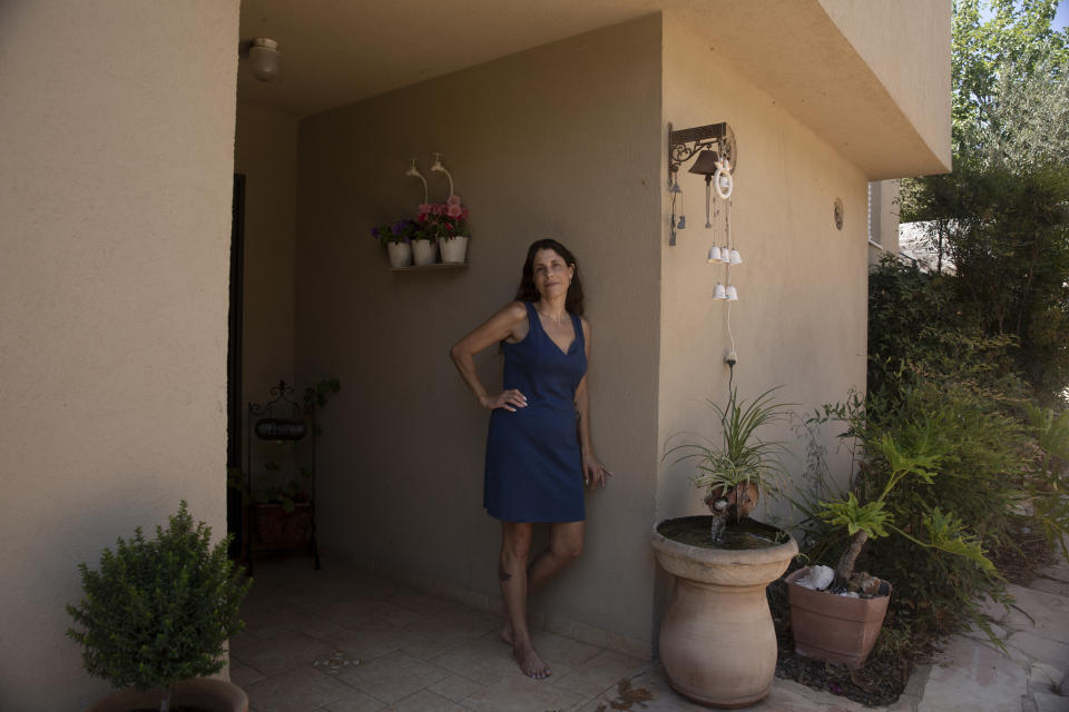 Idit Harel Segal, who donated a kidney to a Palestinian child from the Gaza Strip, poses for a portrait in her home in Eshhar, northern Israel, Tuesday, July 13, 2021. (AP Photo/Maya Alleruzzo)