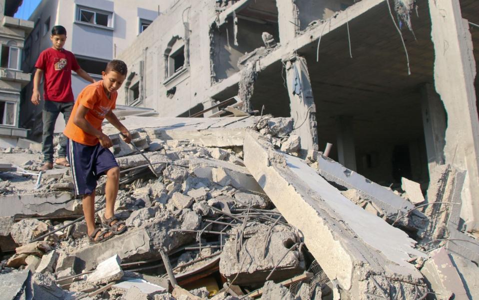 *** BESTPIX *** GAZA CITY, GAZA - OCTOBER 14: Palestinian citizens inspect damage to their homes caused by Israeli airstrikes on October 14, 2023 in Gaza City, Gaza. Many Gazan citizens have fled to the south following warnings from the Israeli government to do so. Israel has sealed off Gaza and launched sustained retaliatory air strikes, which have killed at least 1,400 people with more than 300,000 displaced, after a large-scale attack by Hamas. On October 7, the Palestinian militant group Hamas launched a surprise attack on Israel from Gaza by land, sea, and air, killing over 1,300 people and wounding around 2,800. Israeli soldiers and civilians have also been taken hostage by Hamas and moved into Gaza. The attack prompted a declaration of war by Israeli Prime Minister Benjamin Netanyahu and the announcement of an emergency wartime government. (Photo by Ahmad Hasaballah/Getty Images)