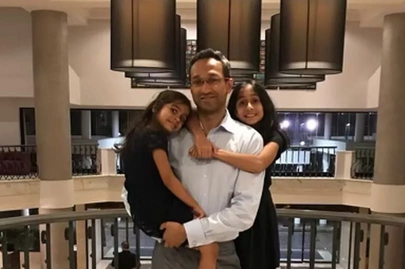 Professor Amit Patel and his two daughters -Credit:Family handout