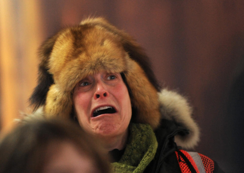 Lisa Frederic reacts while watching a video of Iditarod musher Jeff King driving his dog team through the Dalzell Gorge at the Takotna, Alaska, checkpoint during the 2014 Iditarod Trail Sled Dog Race on Thursday, March 6, 2014.(AP Photo/The Anchorage Daily News, Bob Hallinen) LOCAL TV OUT (KTUU-TV, KTVA-TV) LOCAL PRINT OUT (THE ANCHORAGE PRESS, THE ALASKA DISPATCH)