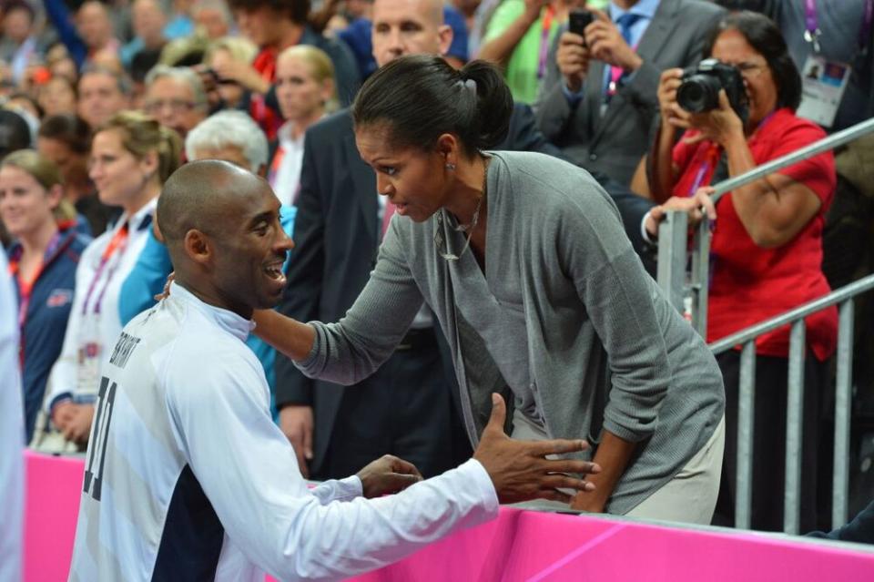 From left: Kobe Bryant talks with former First Lady Michelle Obama during the 2012 Summer Olympics | Jesse D. Garrabrant/NBAE via Getty Images