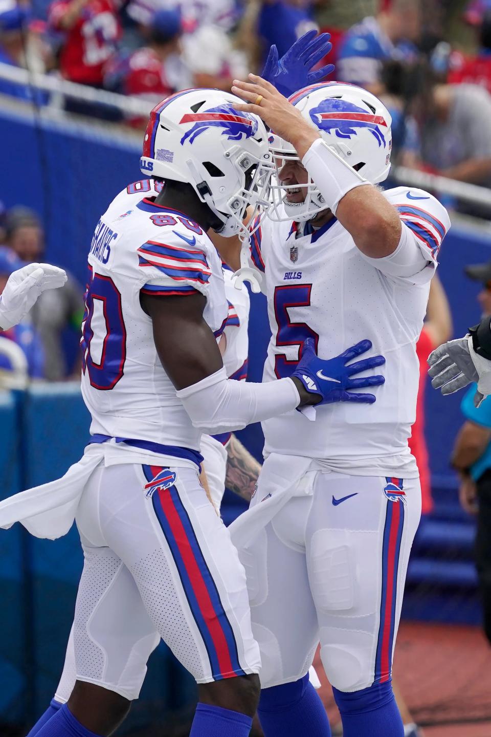 Matt Barkley (5) celebrates with Tyrell Shavers after they connected for a touchdown Saturday against the Colts.