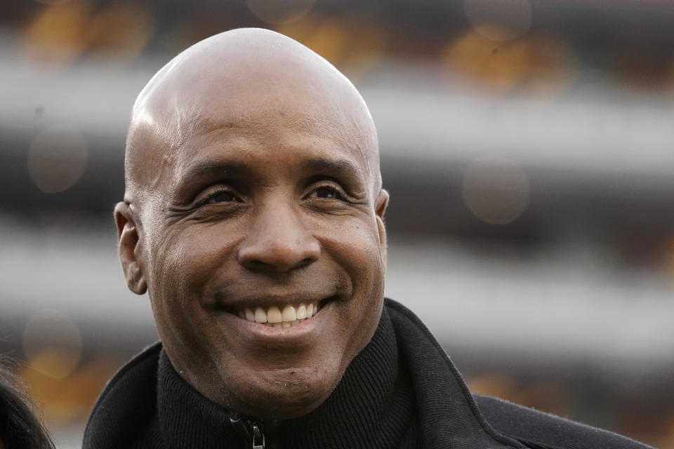 Former baseball player Barry Bonds smiles before the NFC championship game. (AP Photo/Tony Avelar)