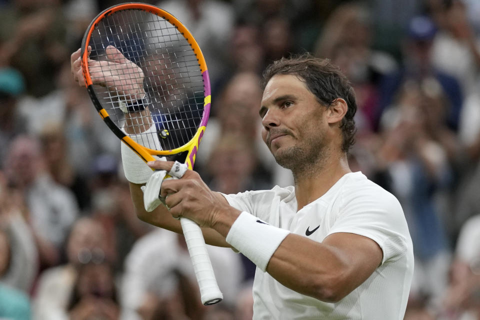 Spain's Rafael Nadal celebrates defeating Italy's Lorenzo Sonego during a third round men's singles match on day six of the Wimbledon tennis championships in London, Saturday, July 2, 2022. (AP Photo/Alastair Grant)