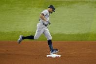 New York Yankees' Giancarlo Stanton rounds second after hitting a solo home run, his 62nd of the season, in the fifth inning of the second baseball game of a doubleheader against the Texas Rangers in Arlington, Texas, Tuesday, Oct. 4, 2022. With the home run, Judge set the AL record for home runs in a season, passing Roger Maris. (AP Photo/Tony Gutierrez)