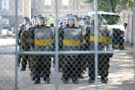 Riot police gather during a protest march at the G7 Summit in Quebec City, Quebec, Canada, June 9, 2018. REUTERS/Chris Wattie