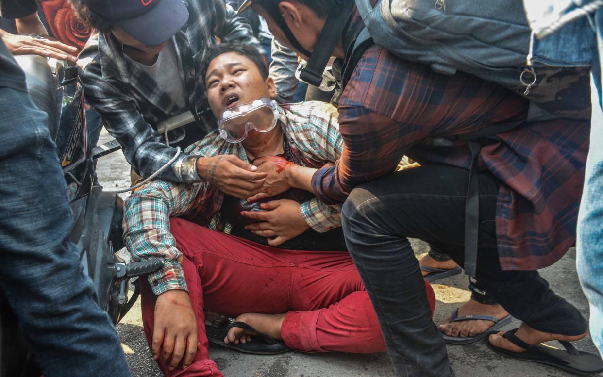 A wounded protester is seen after security forces intervene in protests