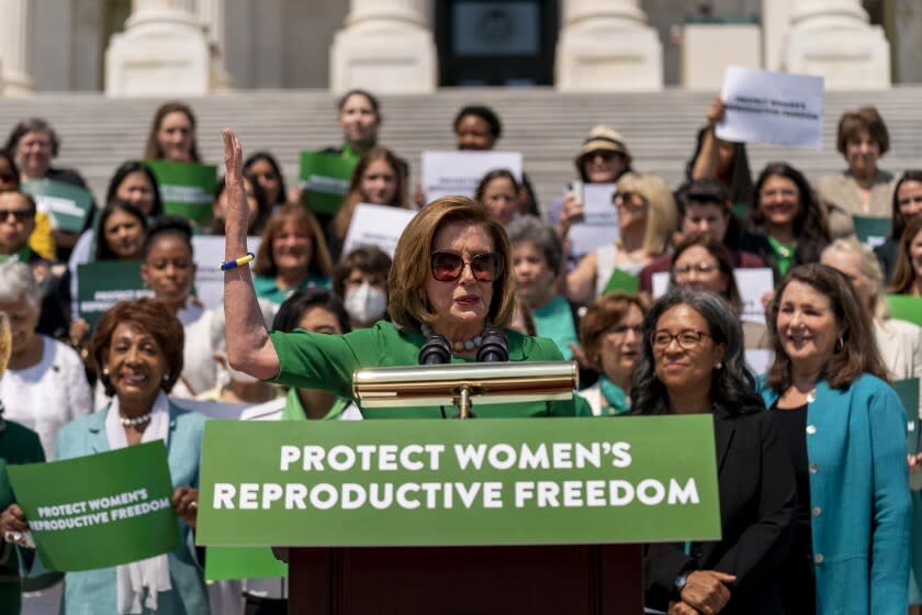 House Speaker Nancy Pelosi of Calif., accompanied by female House Democrats, speaks at an event ahead of a House vote on the Women's Health Protection Act and the Ensuring Women's Right to Reproductive Freedom Act at the Capitol in Washington, Friday, July 15, 2022. (AP Photo/Andrew Harnik)