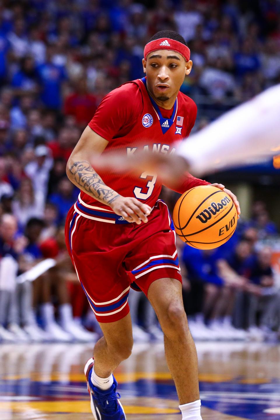 Kansas redshirt junior Dajuan Harris Jr. (3) drives to the hoop against Texas Tech on Tuesday evening at Allen Fieldhouse.