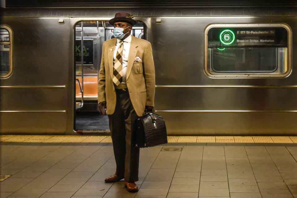 A commuter waits on the platform at a subway station in New York, on March 22, 2023.  (Stephanie Keith / Bloomberg via Getty Images file)