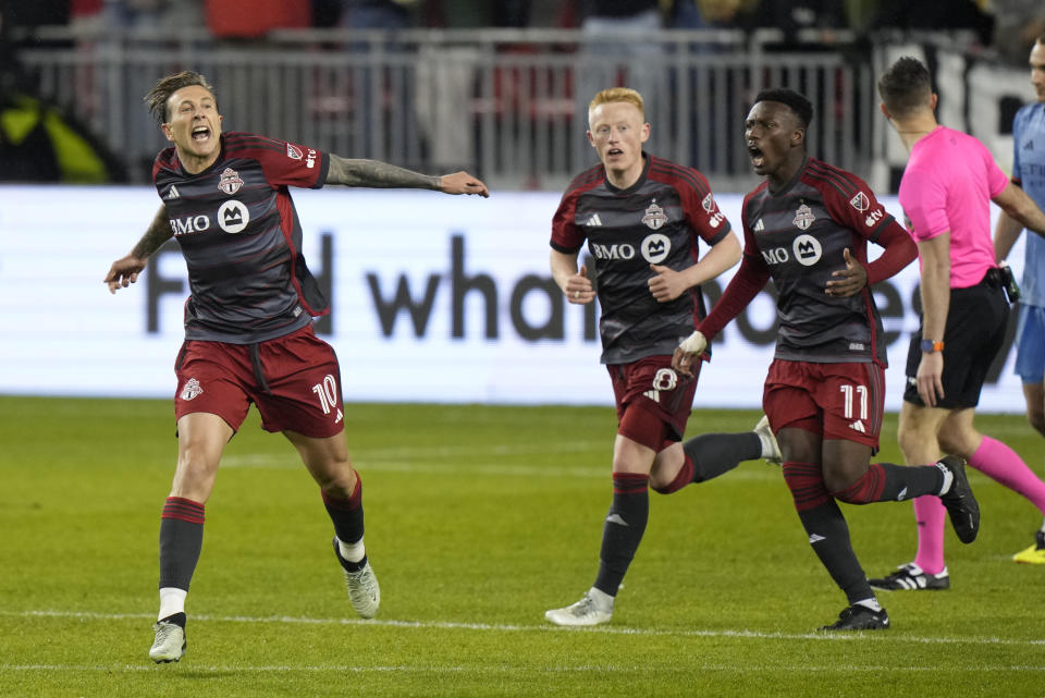 Toronto FC forward Federico Bernardeschi (10) celebrates his goals against NYC FC with midfielder Matty Longstaff (8) and forward Latif Blessing (11) during the second half of an MLS soccer match Saturday, May 11, 2024, in Toronto. (Frank Gunn/The Canadian Press via AP)z