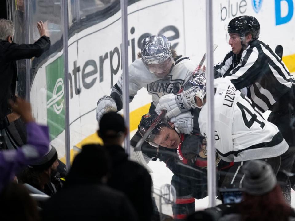 Los Angeles' Brendan Lemieux, top, was suspended five games by the NHL on Tuesday for the above incident in which he bit Ottawa's Brady Tkachuk. (Kyusung Gong/The Associated Press - image credit)