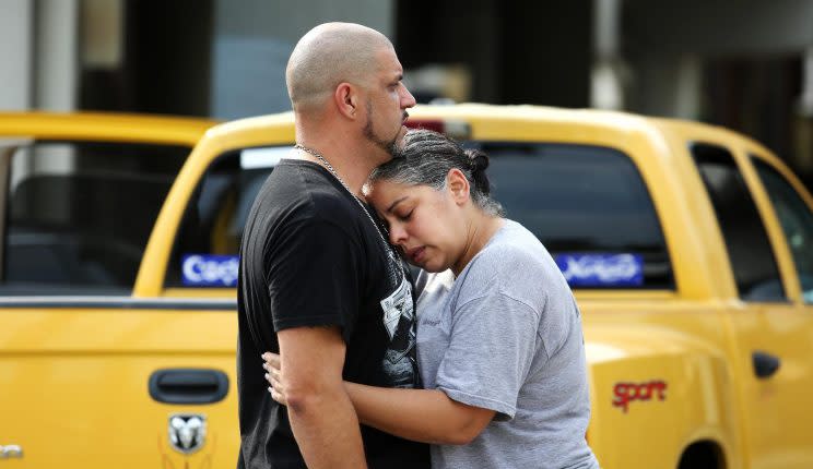 Ray Rivera, a DJ at Pulse nightclub in Orlando, is consoled by a friend outside of the Orlando Police Department after a mass shooting early Sunday morning that left at least 50 people dead. (Photo: Joe Burbank/Orlando Sentinel via AP)