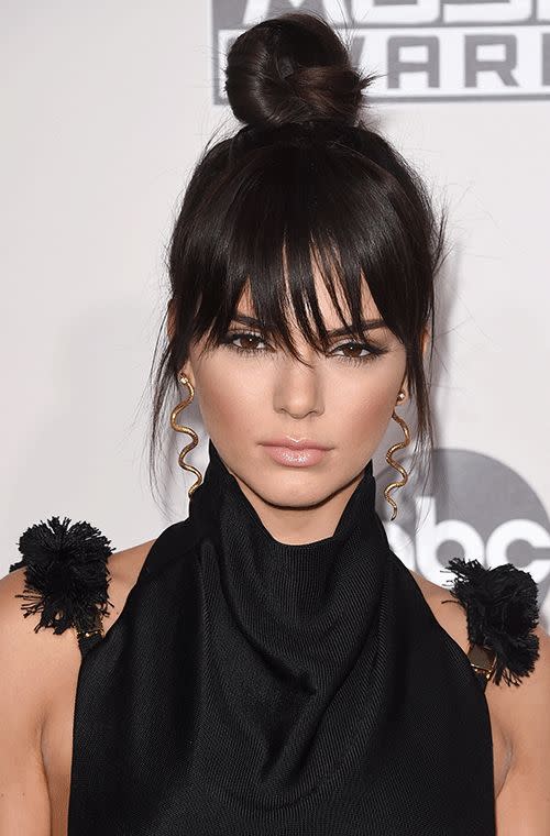 The model also sported a wicked high top bun at the 2015 American Music Awards in Los Angeles. We love how her wispy fringe is slightly covering her piercing kohl-lined eyes, a very seductive look complete with flawlessly bronzed cheeks and pouty pink lips.