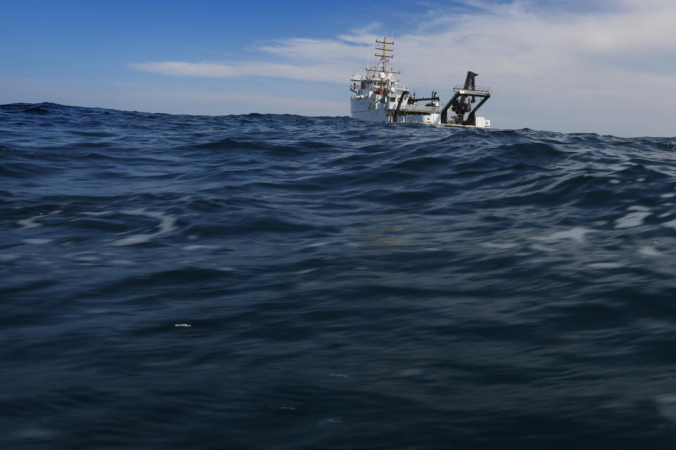 In this Wednesday, Aug. 7, 2019 photo, the NOAA Ship Nancy Foster travels over Gray's Reef, about 20 miles off the coast of Georgia. The 187-foot-long ship was headquarters for a 12-day research mission at the marine sanctuary. The federal research vessel is full of scientists conducting research on subjects ranging from whether invasive lionfish are present to how changing ocean conditions are affecting coral species. (AP Photo/Robert F. Bukaty)