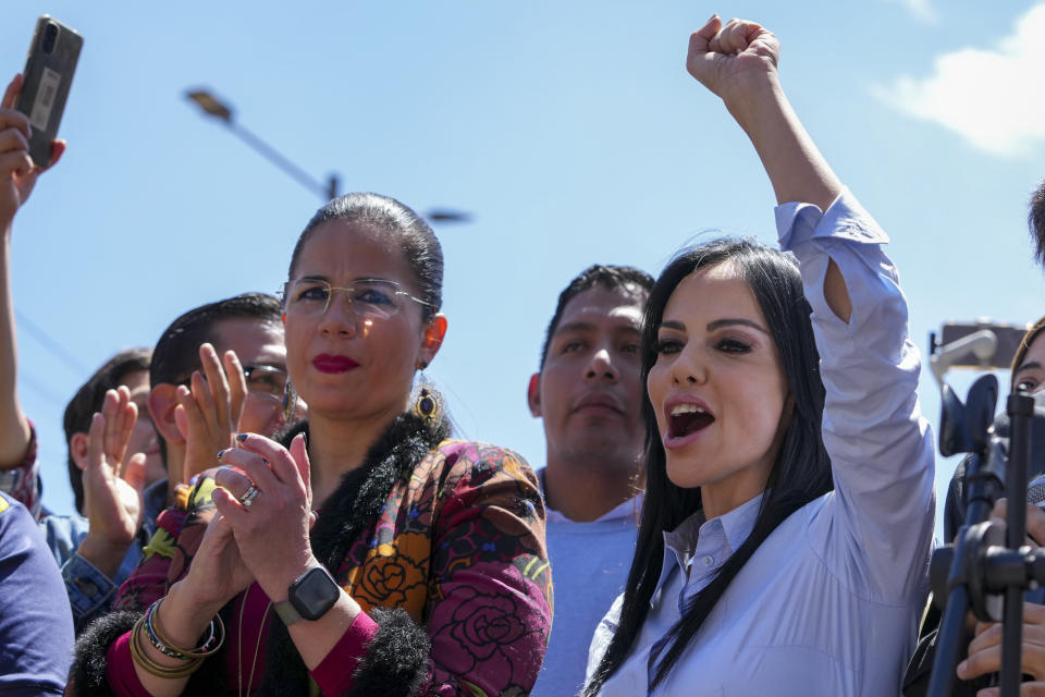 Opposition lawmaker Marcela Holguin, right, speaks to supporters outside the National Assembly in Quito, Ecuador, Wednesday, May 17, 2023. Ecuadorian President Guillermo Lasso on Wednesday put an end to impeachment proceedings against him by dissolving the opposition-led National Assembly, which had accused him of embezzlement. (AP Photo/Dolores Ochoa)