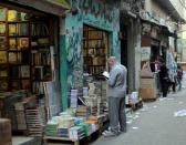 A man looks at a book outside of a bookshop that sells Islamic and reference books for Al-Azhar students near the Al-Azhar mosque in Cairo, Egypt, May 18, 2015. REUTERS/Asmaa Waguih