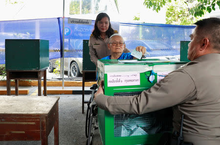 A voter arrives to cast their ballot in the general election at a polling station in Bangkok, Thailand, March 24, 2019. REUTERS/Soe Zeya Tun