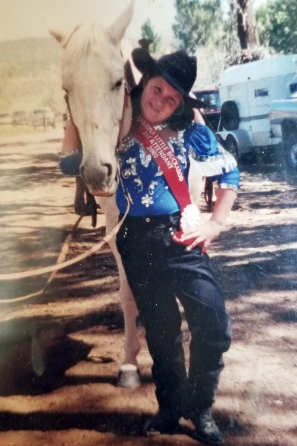 This undated photo provided by the family in 2019 shows Tanna Jo Fillmore as a girl. Jo-Jo or TJ, as her family called her, competed in rodeo barrel races while growing up in Utah. Fillmore, who had a history of mental problems, killed herself in 2016 at the Duchesne County Jail. Her mother, who has filed suit, says her daughter was denied her prescription medications and had threatened to harm herself when they spoke the day before her death. (Courtesy Melany Zoumadakis via AP)