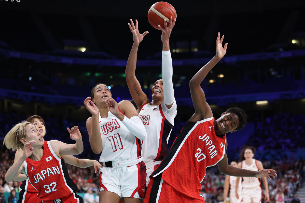 LILLE, FRANCE - JULY 29: A'Ja Wilson #9 of Team United States grabs a rebound over Saori Miyazaki #32 of Team Japan, Napheesa Collier #11 of Team United States and Evelyn Mawuli #30 of Team Japan during the Women's Group Phase - Group C game between Japan and United States on day three of the Olympic Games Paris 2024 at Stade Pierre Mauroy on July 29, 2024 in Lille, France. (Photo by Gregory Shamus/Getty Images)