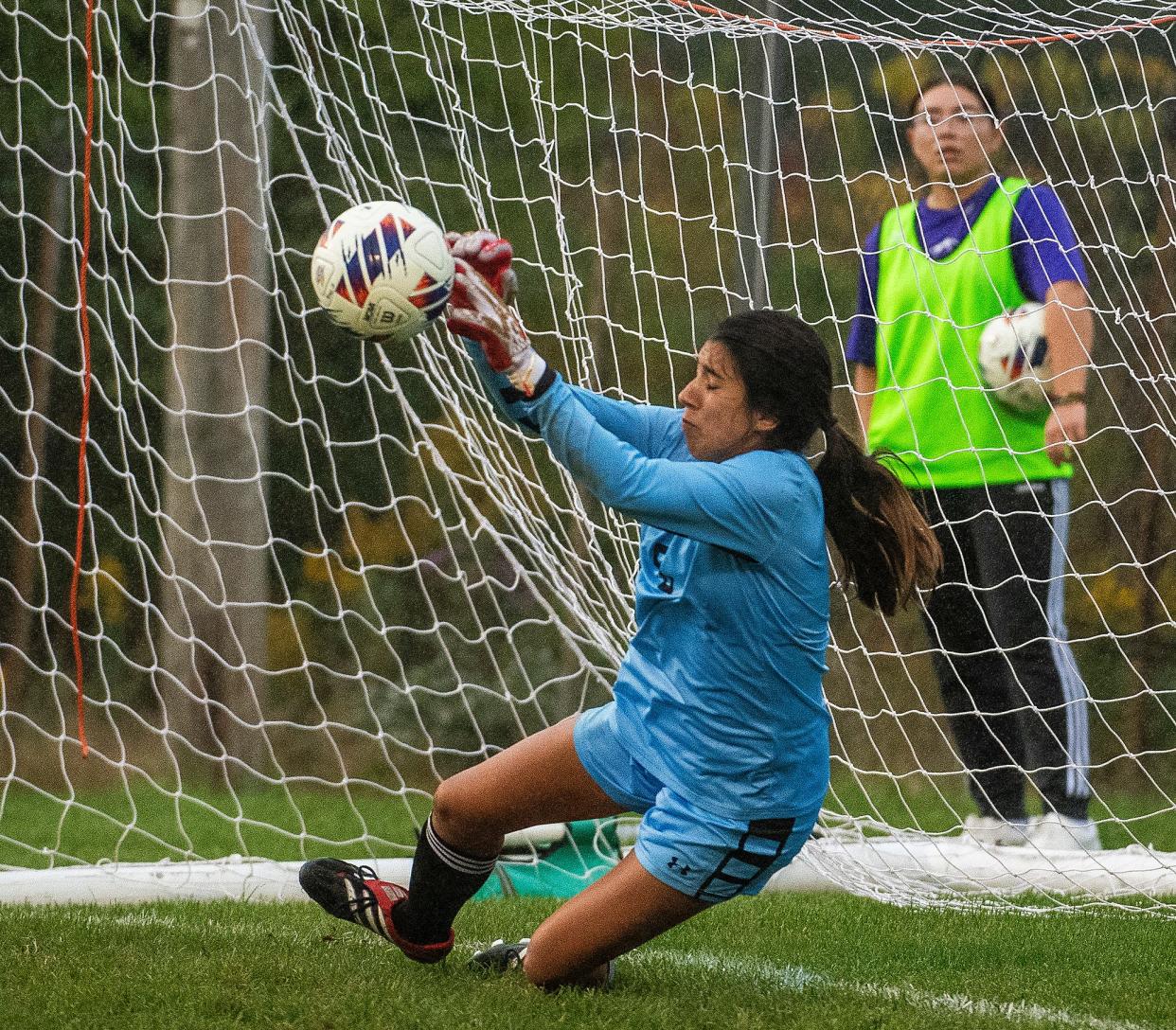 South's Paloma Martinez Labathe (0) blocks a Castle penalty kick attempt during the girls IHSAA regional soccer final at Bloomington High School South on Saturday, Oct. 14, 2023.